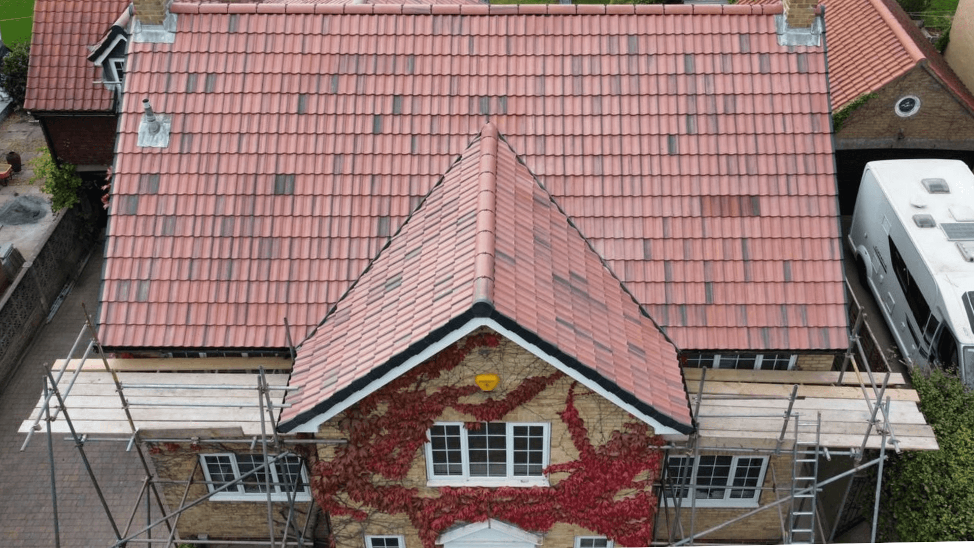 Professional roofers working on a roof in Basingstoke